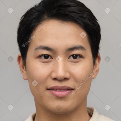 Joyful asian young-adult male with short  black hair and brown eyes