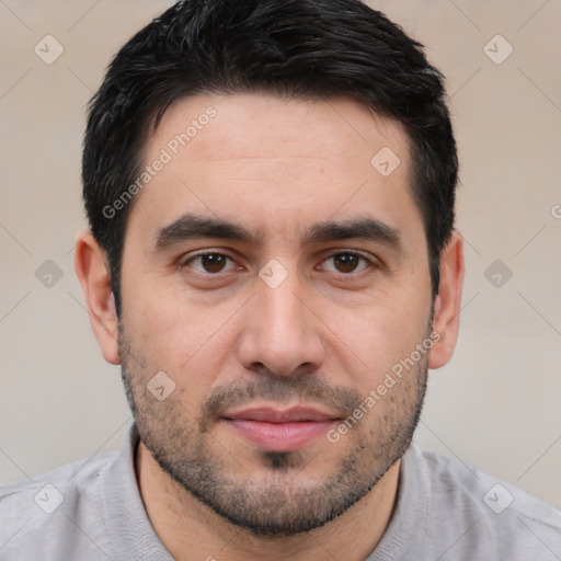 Joyful white young-adult male with short  black hair and brown eyes