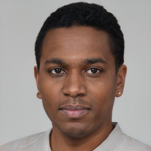 Neutral black young-adult male with short  black hair and brown eyes