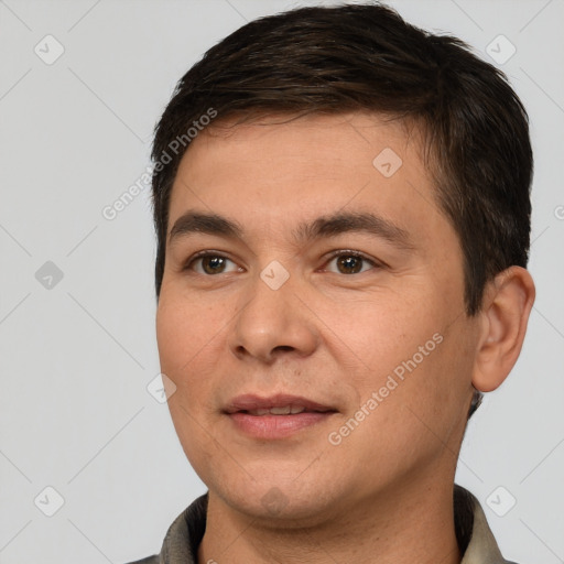 Joyful white young-adult male with short  brown hair and brown eyes