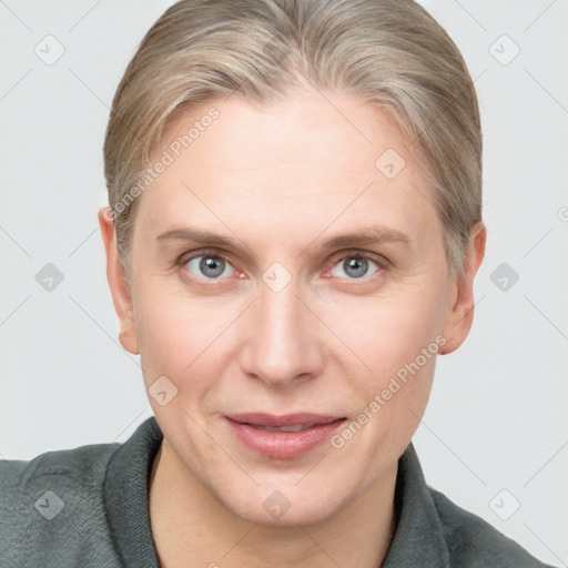 Joyful white adult female with short  brown hair and grey eyes