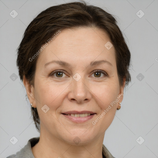 Joyful white adult female with short  brown hair and brown eyes