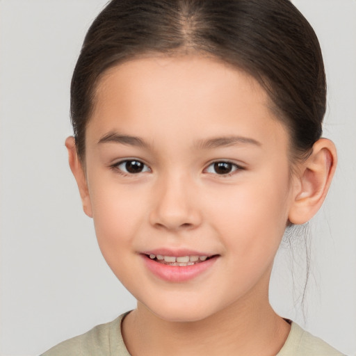 Joyful white child female with short  brown hair and brown eyes