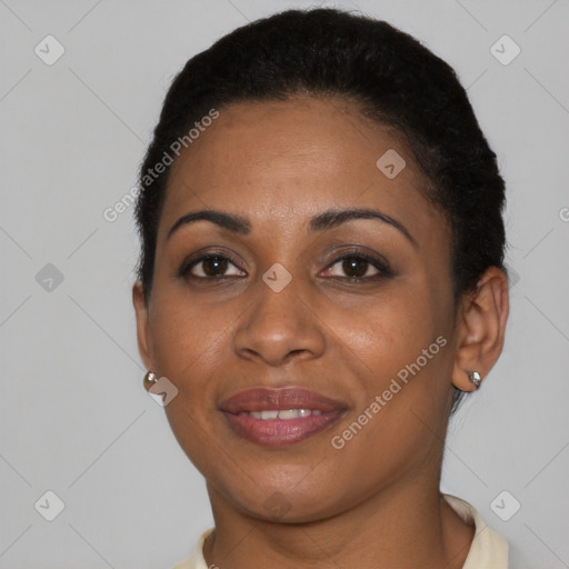 Joyful black young-adult female with short  black hair and brown eyes
