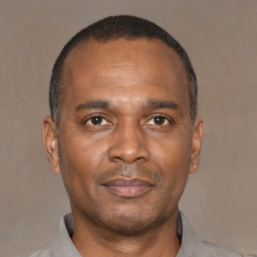 Neutral latino adult male with short  black hair and brown eyes