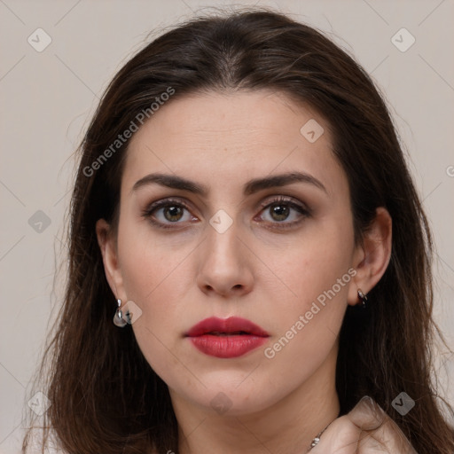 Neutral white young-adult female with long  brown hair and brown eyes