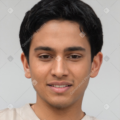 Joyful latino young-adult male with short  black hair and brown eyes