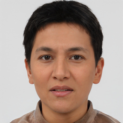 Joyful asian young-adult male with short  brown hair and brown eyes
