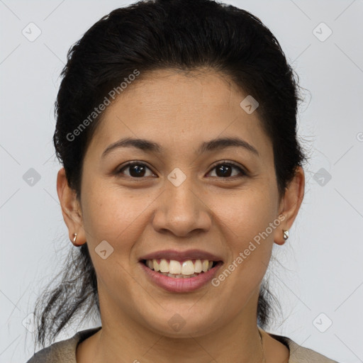 Joyful latino young-adult female with short  brown hair and brown eyes