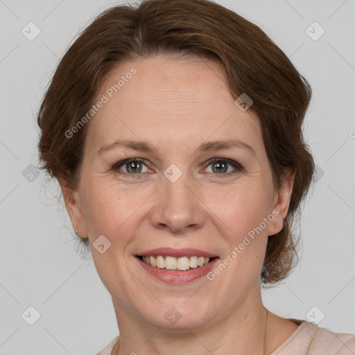 Joyful white adult female with medium  brown hair and grey eyes