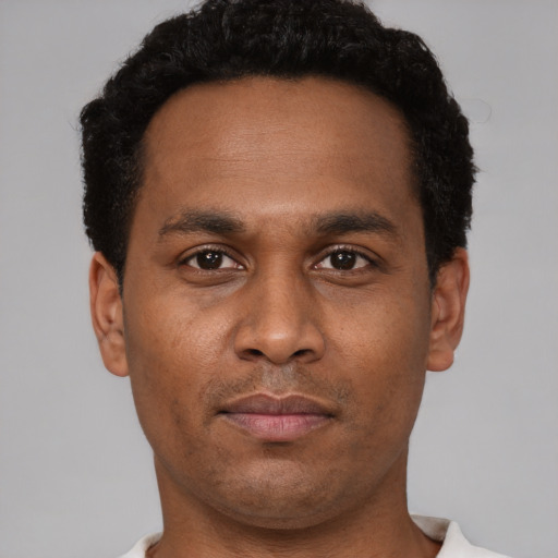 Neutral black young-adult male with short  brown hair and brown eyes