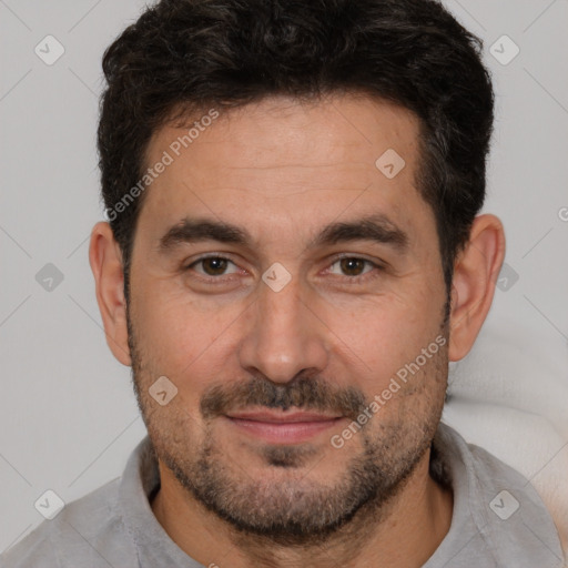 Joyful white adult male with short  brown hair and brown eyes