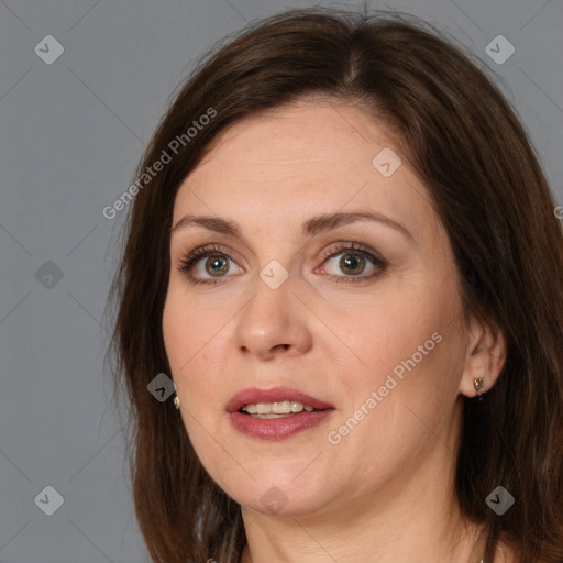 Joyful white adult female with medium  brown hair and brown eyes