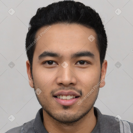 Joyful asian young-adult male with short  black hair and brown eyes