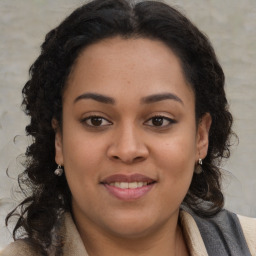 Joyful black young-adult female with medium  brown hair and brown eyes