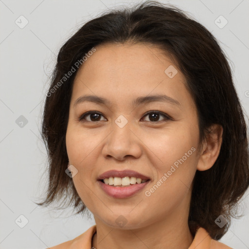 Joyful white adult female with medium  brown hair and brown eyes