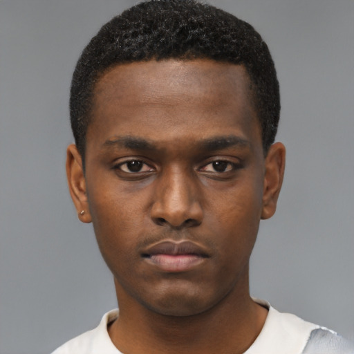 Neutral black young-adult male with short  black hair and brown eyes