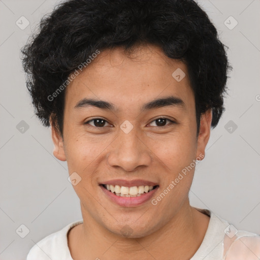 Joyful latino young-adult male with short  brown hair and brown eyes