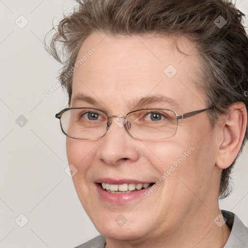 Joyful white adult female with short  brown hair and brown eyes