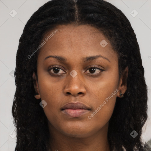 Neutral black young-adult female with long  brown hair and brown eyes