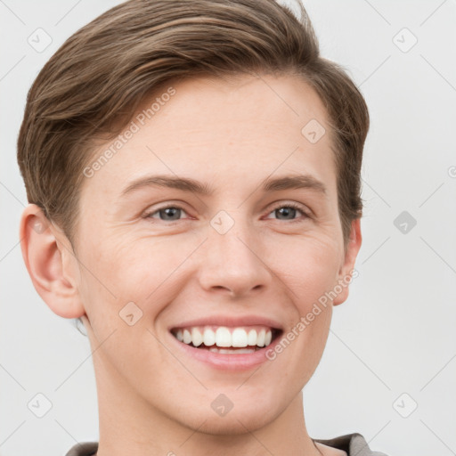 Joyful white young-adult female with short  brown hair and grey eyes