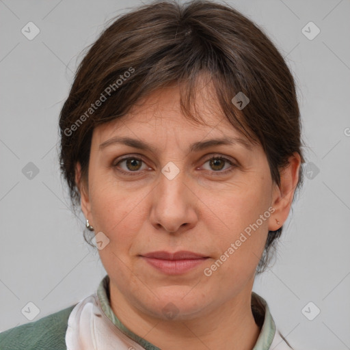 Joyful white adult female with medium  brown hair and brown eyes