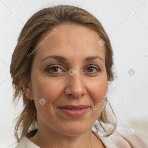 Joyful white adult female with medium  brown hair and brown eyes