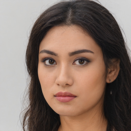 Neutral asian young-adult female with long  brown hair and brown eyes