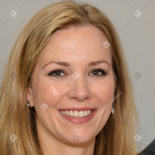 Joyful white adult female with long  brown hair and brown eyes