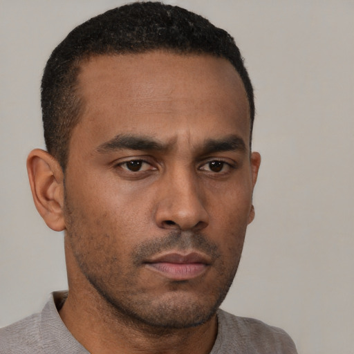Neutral latino young-adult male with short  brown hair and brown eyes