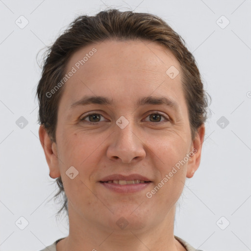 Joyful white adult female with short  brown hair and brown eyes