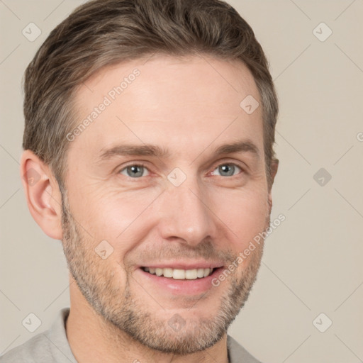 Joyful white adult male with short  brown hair and grey eyes