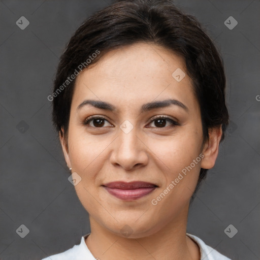 Joyful latino young-adult female with short  brown hair and brown eyes