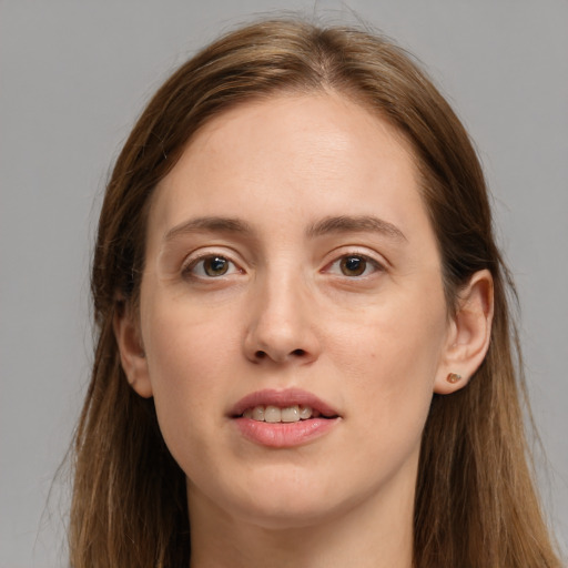 Joyful white young-adult female with long  brown hair and grey eyes