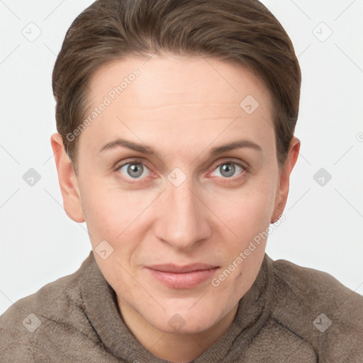 Joyful white young-adult female with short  brown hair and grey eyes