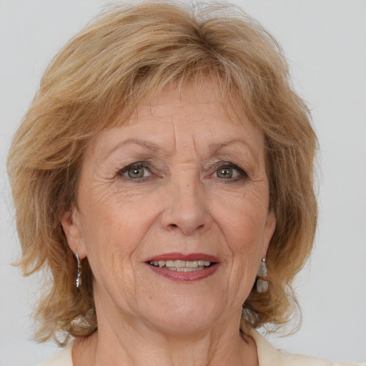 Joyful white middle-aged female with medium  brown hair and brown eyes