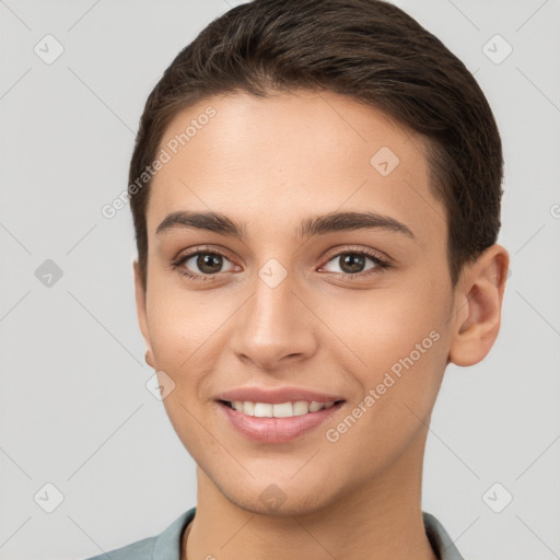 Joyful white young-adult female with short  brown hair and brown eyes