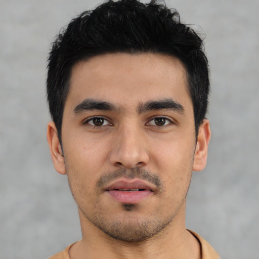 Neutral latino young-adult male with short  black hair and brown eyes