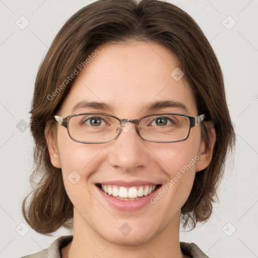 Joyful white young-adult female with medium  brown hair and green eyes