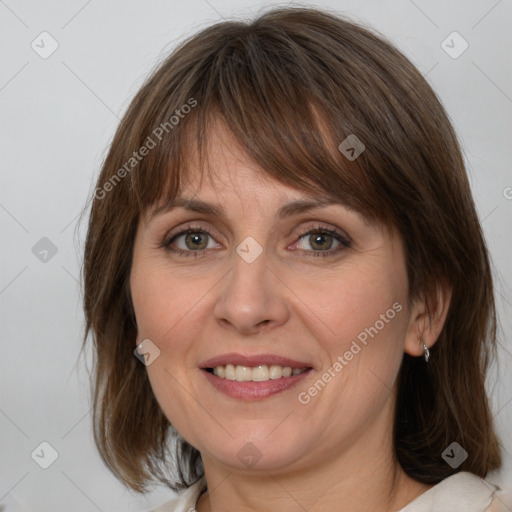 Joyful white adult female with medium  brown hair and grey eyes