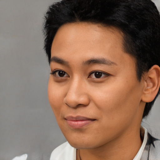 Joyful asian young-adult female with short  black hair and brown eyes