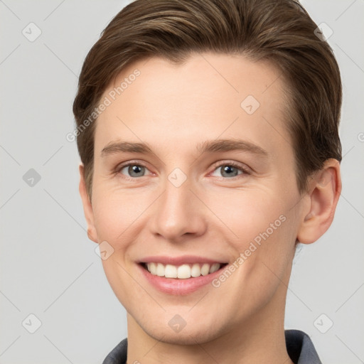 Joyful white young-adult female with short  brown hair and grey eyes