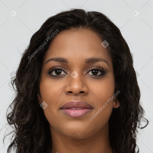 Joyful black young-adult female with long  black hair and brown eyes