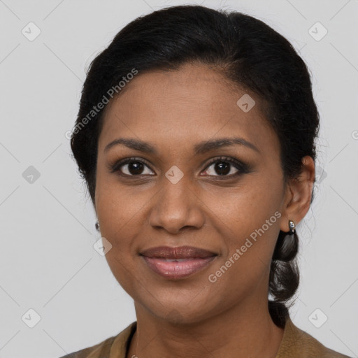 Joyful black young-adult female with medium  brown hair and brown eyes