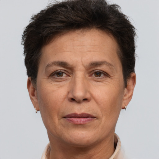 Joyful white adult female with short  brown hair and brown eyes