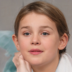 Joyful white child female with medium  brown hair and blue eyes