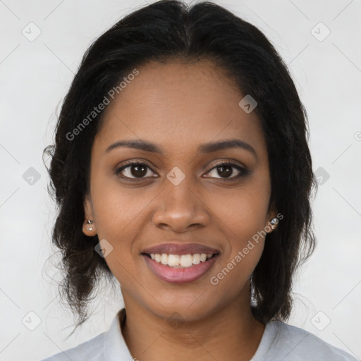 Joyful black young-adult female with long  brown hair and brown eyes