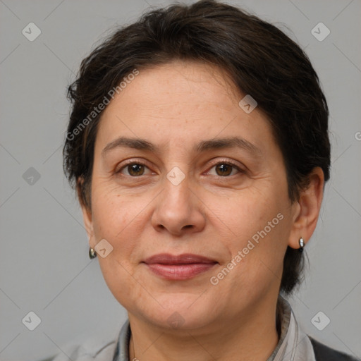 Joyful white adult female with medium  brown hair and brown eyes