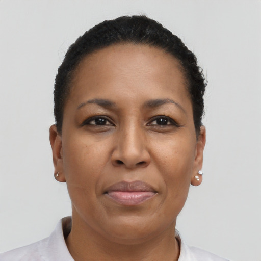 Joyful black adult female with short  brown hair and brown eyes