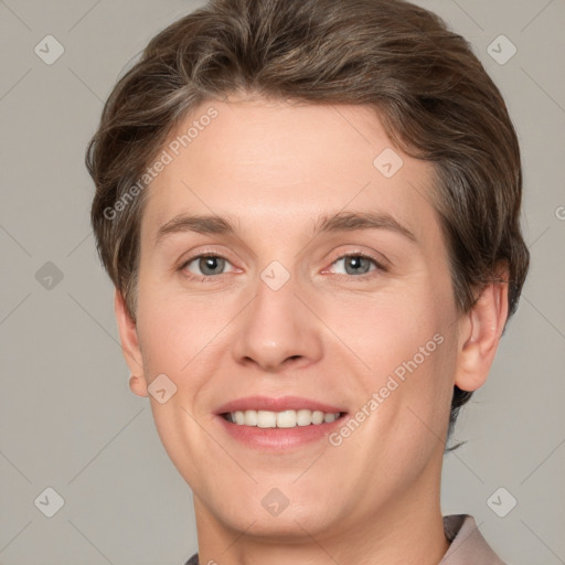 Joyful white young-adult female with short  brown hair and grey eyes